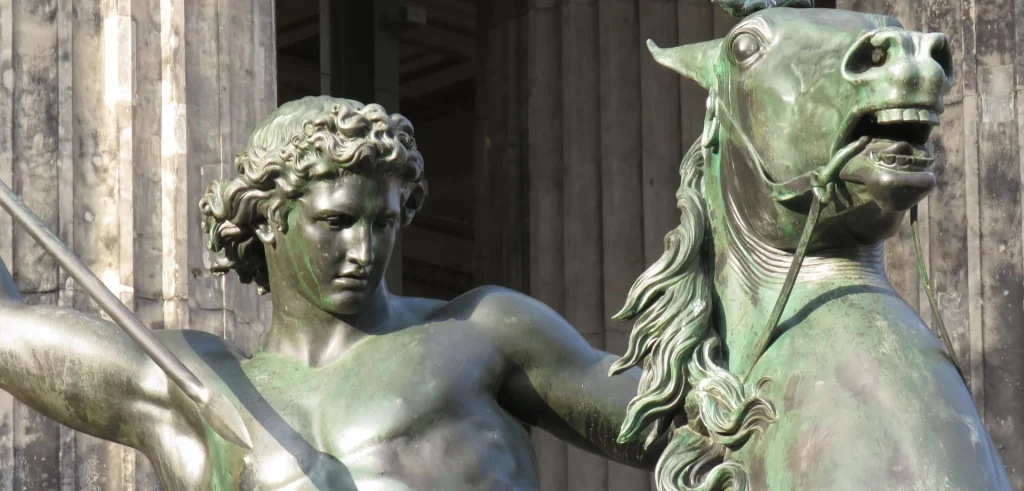 A close-up of a bronze horseman statue showing fine craftsmanship and natural patina.