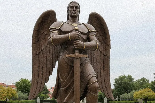 Monumental bronze St Michael statue with sword pointing down