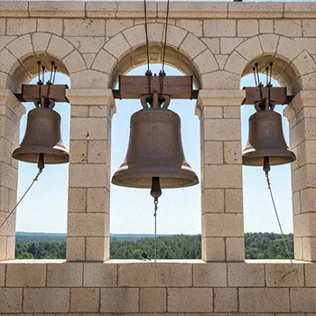 Bronze church bells in stone tower