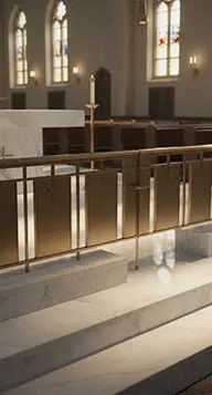 Marble altar steps leading to brass communion rail gate