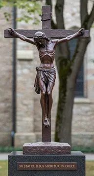 Antique bronze Crucifix statue Jesus on the cross for outdoor memorial
