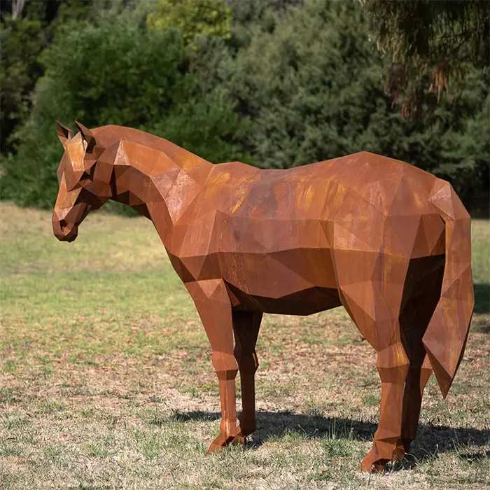 Life-size rusty corten steel horse sculpture with natural weathering finish on green lawn