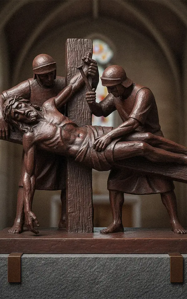 Bronze Stations of the Cross relief sculpture showing Jesus falling