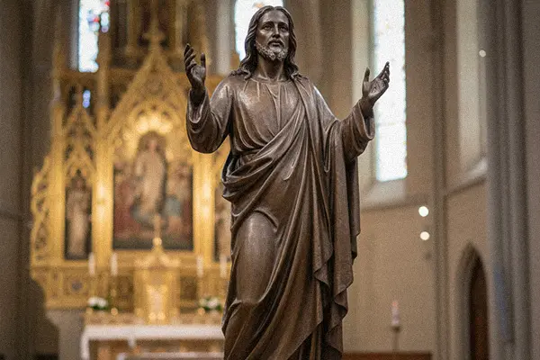 Large bronze Risen Christ statue with raised hands for altar