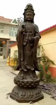 Bronze Guanyin statue, showcasing traditional material for outdoor religious sculptures with natural patina.