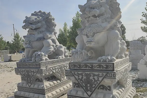 Large carved stone Foo Dog statues for front porch entrance