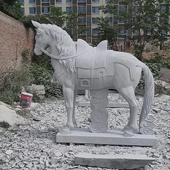 Hand carved natural stone horse statue standing in rubble