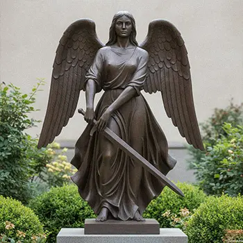 Detail of bronze angel wings and sword showing metal texture