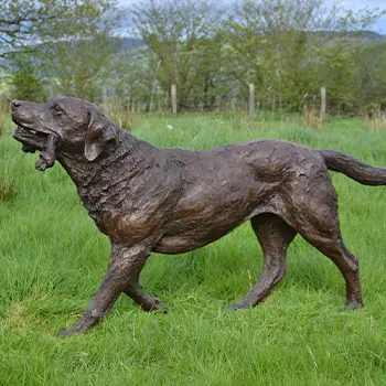 Antique bronze Labrador dog statue in garden
