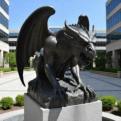Black bronze gargoyle statue sitting on pedestal