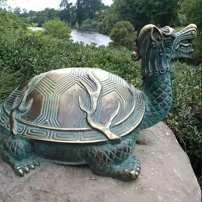 Detailed bronze sea turtle statue with natural patina