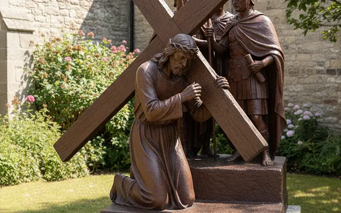 Large bronze outdoor Stations of the Cross statue Jesus falling under the weight of the cross