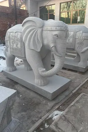 White marble elephant statue with trunk up for good luck