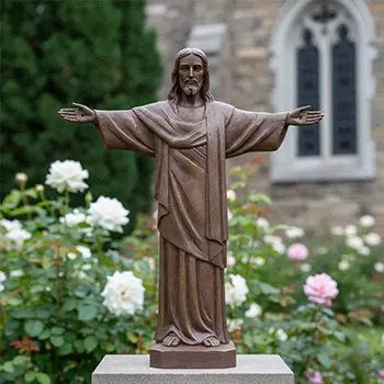 Life-size bronze Rio Jesus statue standing in rose garden