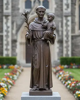 Bronze St Anthony statue holding baby Jesus and lily