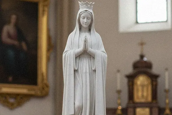 White marble Our Lady of Fatima statue wearing crown