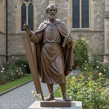 Bronze St Joseph the Worker statue holding saw and carpenter tools