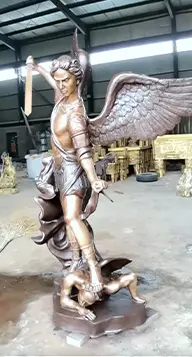 Dynamic bronze statue of St Michael slaying the devil dragon