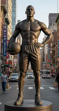 Bronze basketball player statue on a city street, representing team sports athlete sculptures.