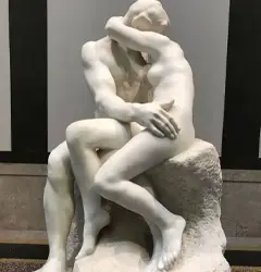 White marble replica of Rodin's The Kiss statue
