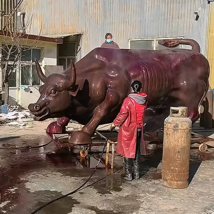 Charging Bull statue in factory workshop