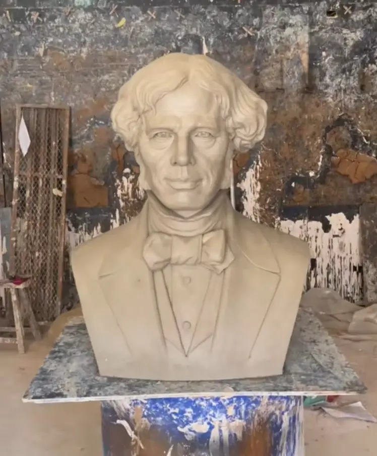 Two images comparing the process:
First image: Hand-sculpted clay model of the bust