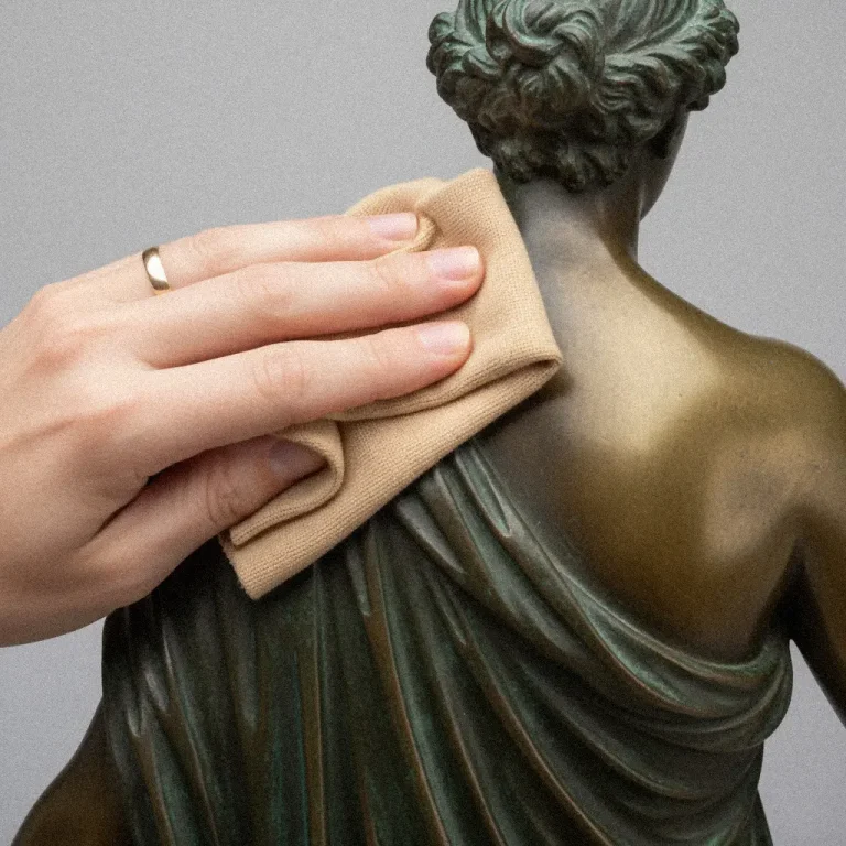Cleaning and polishing the bronze statue