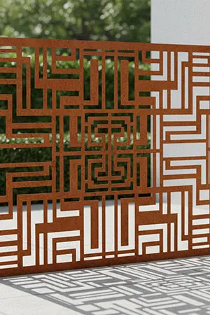 Laser cut corten steel privacy screen with geometric pattern