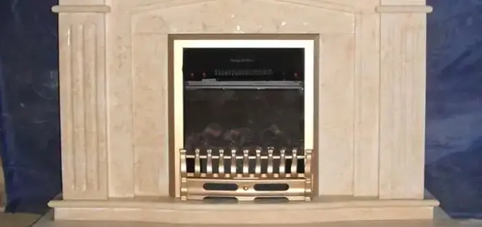 Custom beige marble fireplace surround made to fit electric firebox insert
