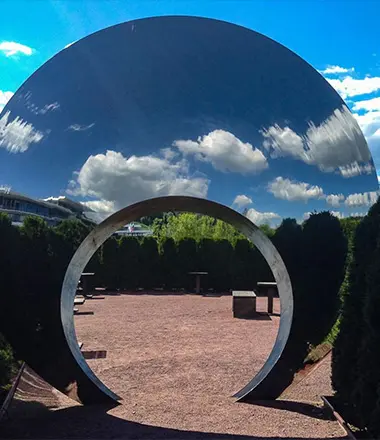 Monumental mirror polished stainless steel moon gate ring sculpture