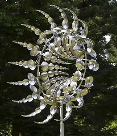 Silver kinetic wind sculpture infinity shape for garden