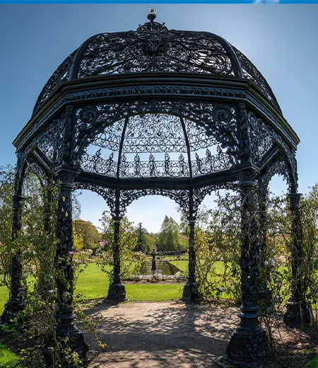 Detailed wrought iron scroll work on gazebo dome roof