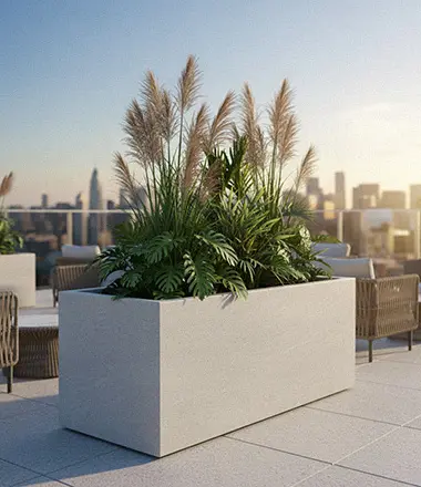 Large rectangular limestone planter box on rooftop garden