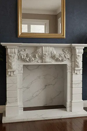 White marble fireplace with intricate carvings in a luxurious living room