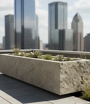 Long stone planter boxes dividing outdoor seating area