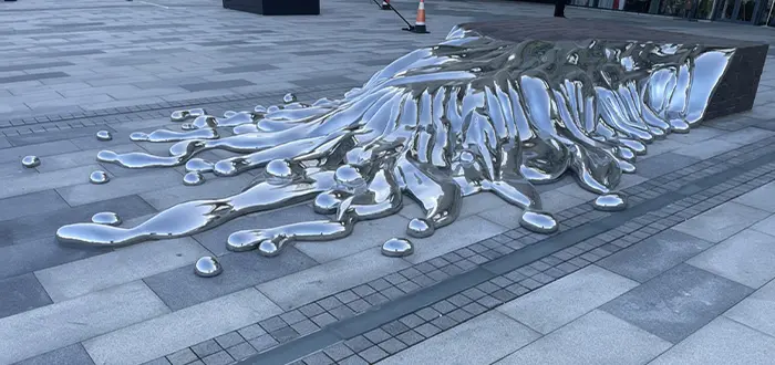 Liquid metal effect stainless steel sculpture floor installation public art