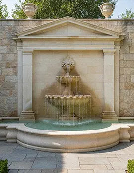 Limestone wall fountain with lion head spout for courtyard