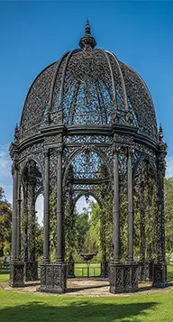 Ornate black iron gazebo structure in park setting