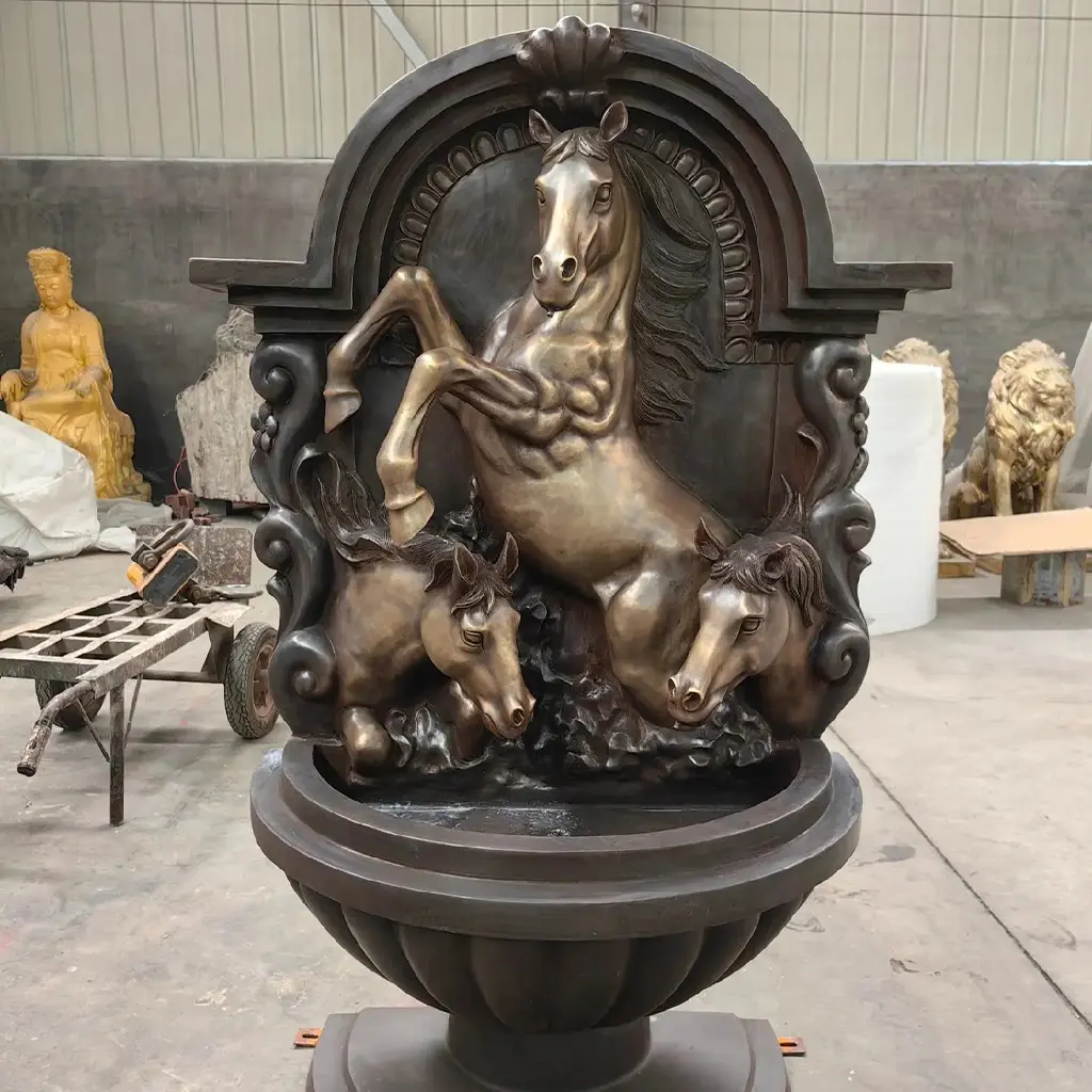 Outdoor bronze wall fountain featuring a high-relief rearing horse sculpture, space-saving water feature design for garden walls or driveways.