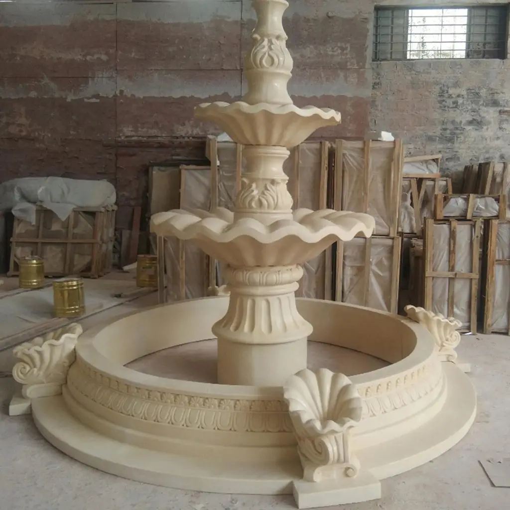 Classical hand-carved marble fountain assembled inside workshop, engineered internal drainage and pressure-tested basin joints.