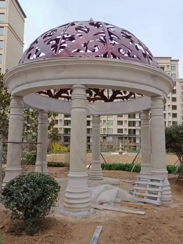 Estate stone gazebo functioning as long-term architectural feature in garden setting.