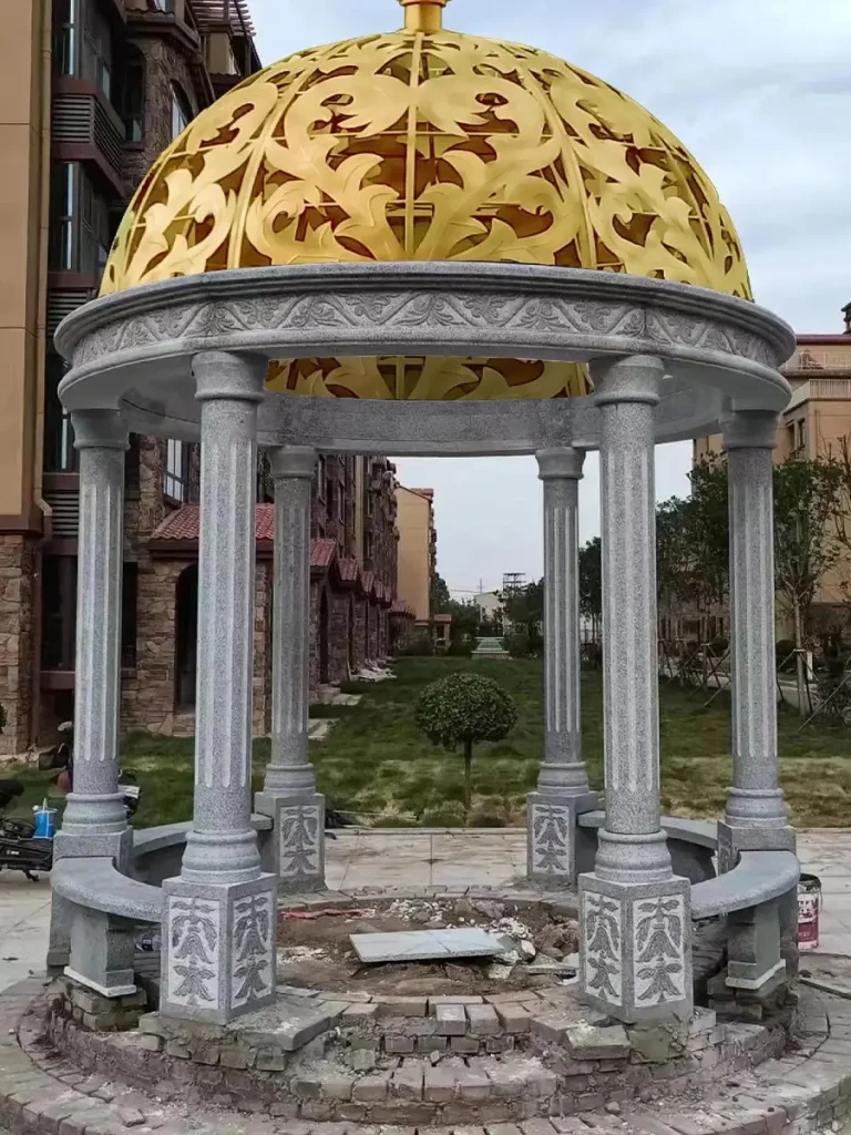 Large garden pavilion built from natural marble with load-bearing stone columns.