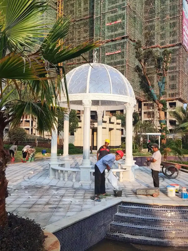 Luxury marble gazebo integrated into landscaped estate garden demonstrating long term property value enhancement