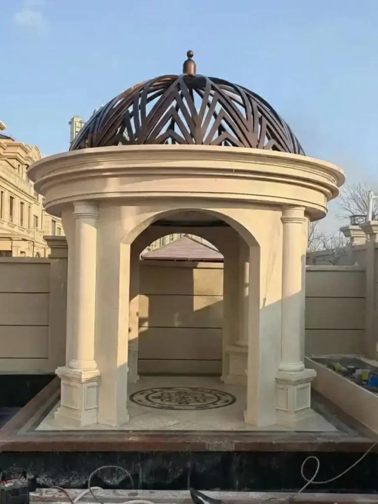 Hand-carved marble garden pavilion installed as permanent structure in private estate landscape.