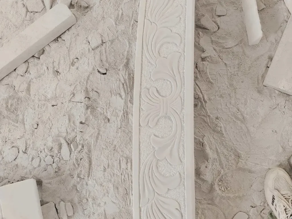 Marble gazebo structural beam with hand carved classical relief patterns demonstrating high end custom garden architecture detail