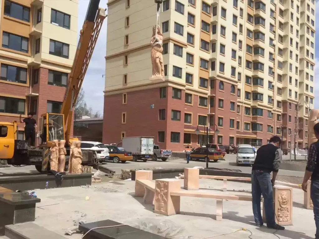 Close-up of numbered marble column sections prepared for organized on-site installation.