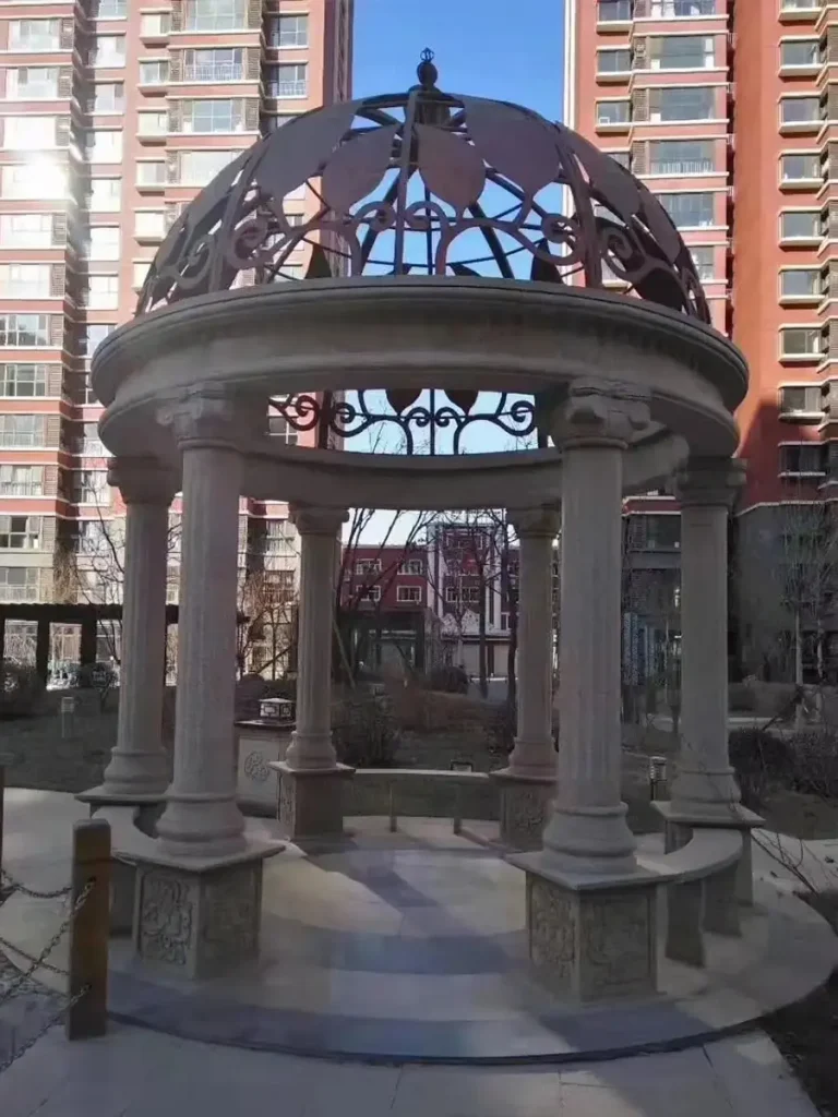 Marble outdoor architectural structure enhancing luxury estate environment.