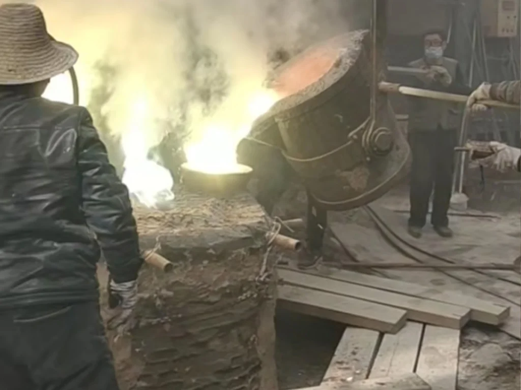 Pouring molten bronze into ceramic mold for a life-size horse statue