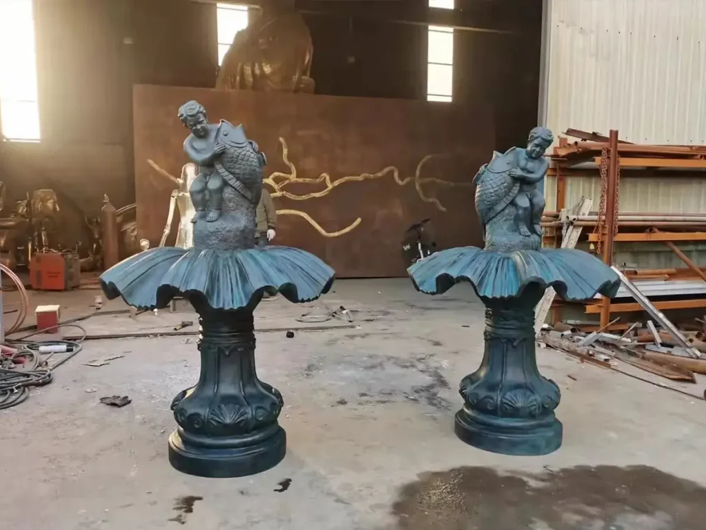 Completed solid silicon bronze fountain inside foundry workshop, highlighting real bronze casting instead of thin metal plating.