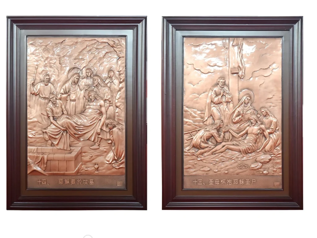 High-relief bronze Stations plaques depicting Station XIII Mary holding the body of Christ after crucifixion and Station XIV Jesus laid in the tomb with deep relief carving